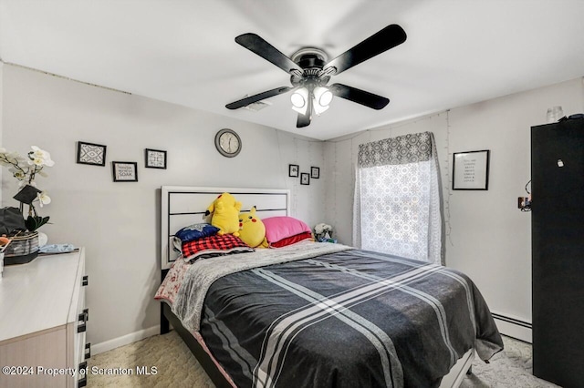 bedroom with a baseboard radiator, ceiling fan, and light colored carpet