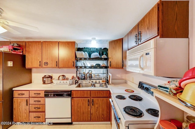 kitchen featuring ceiling fan, white appliances, and sink