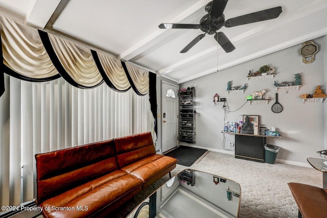 living room featuring carpet flooring, ceiling fan, and beamed ceiling