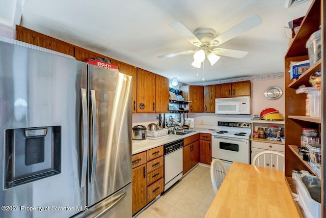 kitchen with ceiling fan, sink, and white appliances