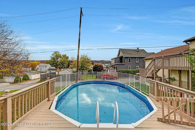 view of swimming pool featuring a deck