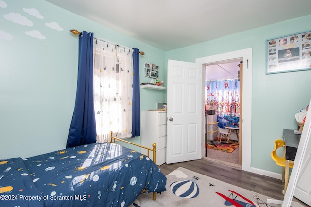 bedroom featuring hardwood / wood-style floors