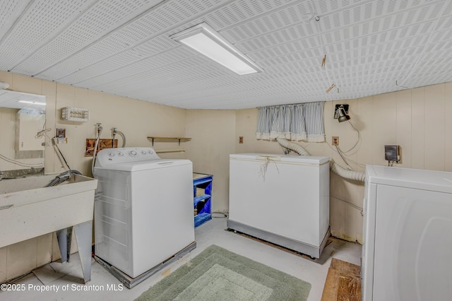 laundry area with washing machine and clothes dryer