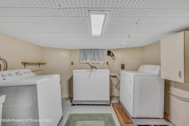 laundry area with washing machine and clothes dryer