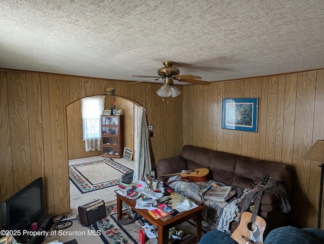 430 14th Ave, Scranton, PA 18504 - carpeted living room with a ceiling fan, wood walls, and a textured ceiling