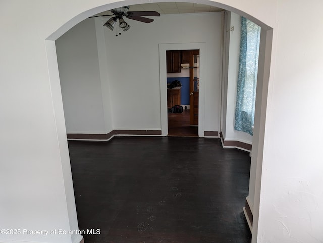 430 14th Ave, Scranton, PA 18504 - unfurnished room with ceiling fan, dark wood finished floors, arched walkways, and baseboards