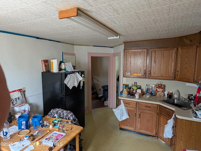 430 14th Ave, Scranton, PA 18504 - kitchen featuring a sink, brown cabinetry, light countertops, and freestanding refrigerator