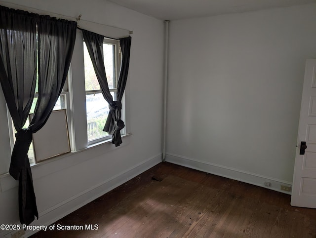 430 14th Ave, Scranton, PA 18504 - unfurnished room featuring dark wood-style flooring, baseboards, and plenty of natural light