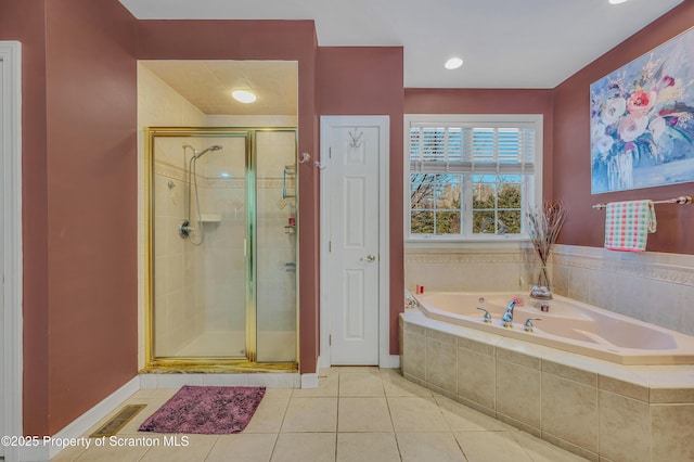 bathroom with tile patterned floors and separate shower and tub