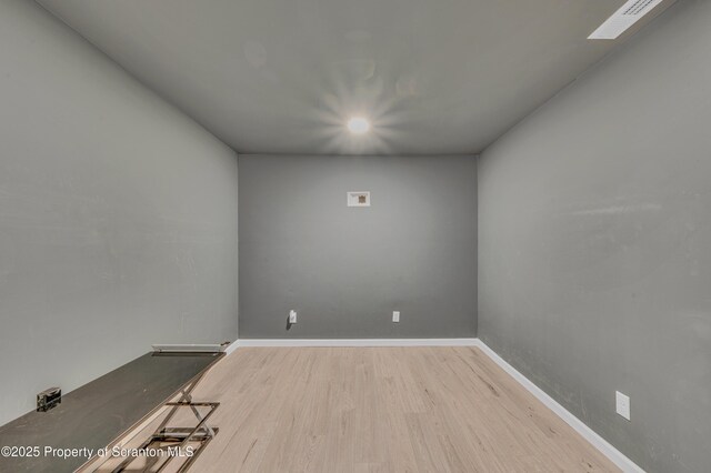 bedroom with ceiling fan and light hardwood / wood-style flooring