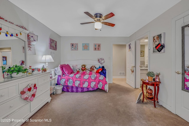 bedroom featuring light colored carpet and ceiling fan