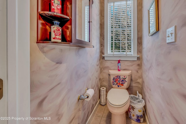 bathroom with plenty of natural light, tile patterned floors, and toilet