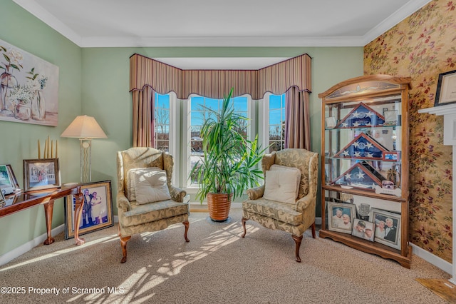 sitting room with crown molding and carpet