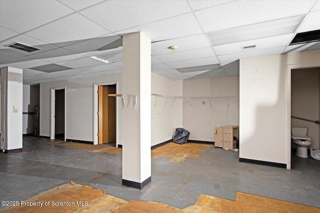 basement featuring a drop ceiling