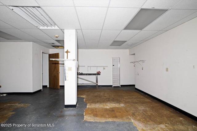 basement featuring a drop ceiling