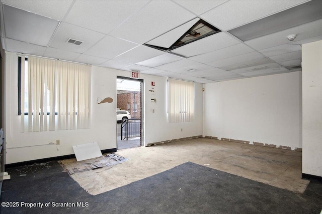 empty room featuring a drop ceiling