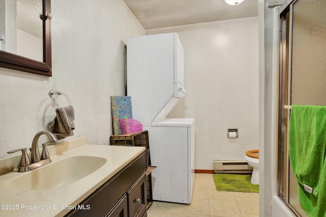 full bathroom with a shower with door, a baseboard heating unit, toilet, tile patterned flooring, and vanity