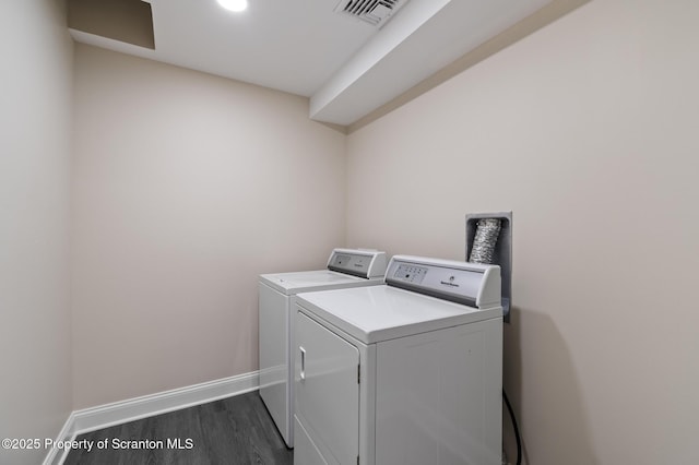 1732 Capouse Ave, Scranton, PA 18509 - washroom with dark wood-style floors, washer and clothes dryer, baseboards, visible vents, and laundry area