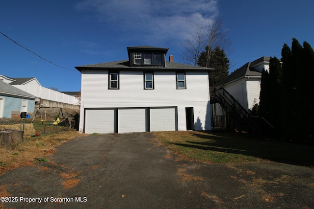 view of side of property featuring a garage