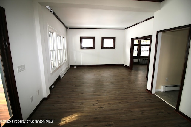 hall with dark wood-type flooring, a baseboard heating unit, and radiator heating unit