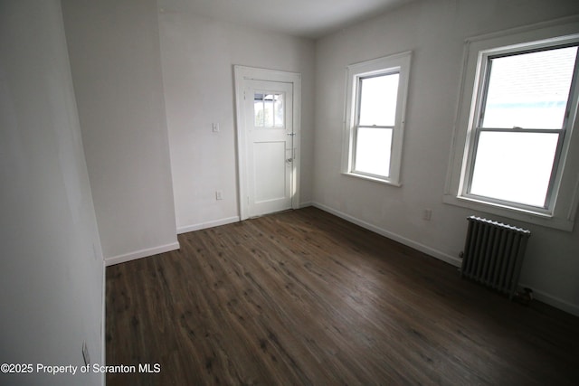 entryway featuring radiator and dark wood-type flooring