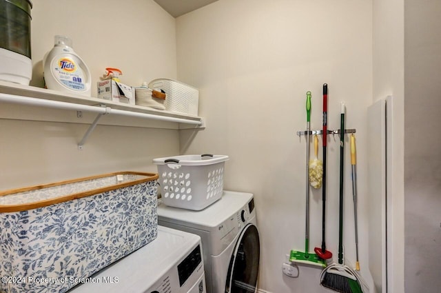 washroom featuring washing machine and dryer