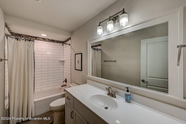 full bathroom with shower / bath combo, vanity, and toilet