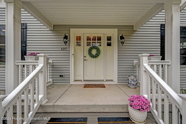 entrance to property with covered porch