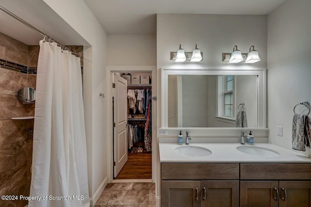 bathroom featuring vanity and walk in shower