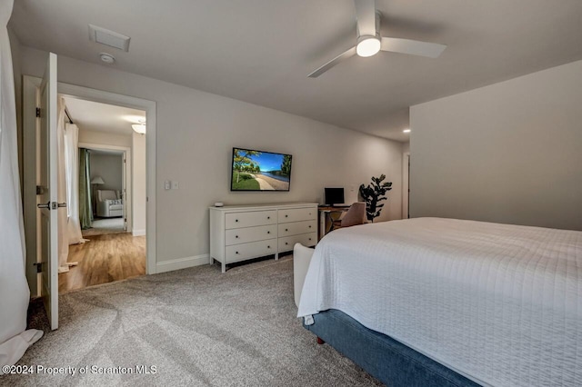 carpeted bedroom with ceiling fan