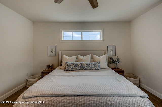 bedroom featuring dark hardwood / wood-style flooring and ceiling fan