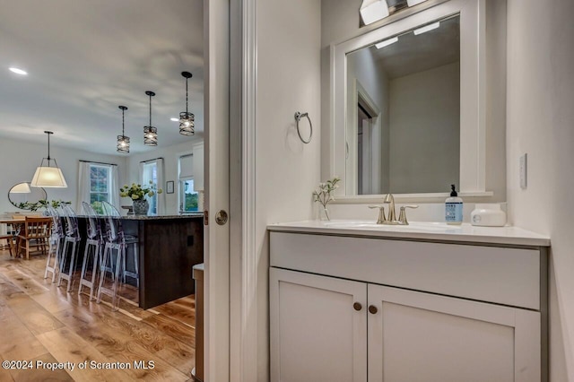 bathroom featuring hardwood / wood-style floors and vanity