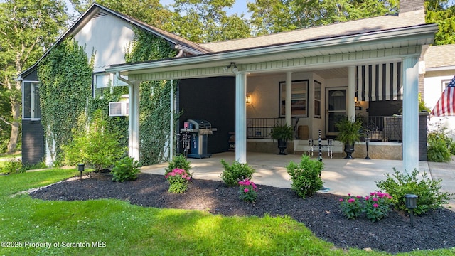 805 E Mountain Rd, Scranton, PA 18505 - rear view of house featuring a porch, a chimney, and roof with shingles