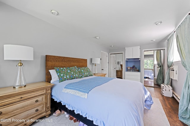 805 E Mountain Rd, Scranton, PA 18505 - bedroom with wood finished floors, baseboard heating, and cooling unit
