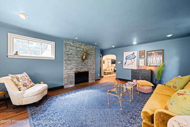 805 E Mountain Rd, Scranton, PA 18505 - living room with arched walkways, wood finished floors, a stone fireplace, and recessed lighting
