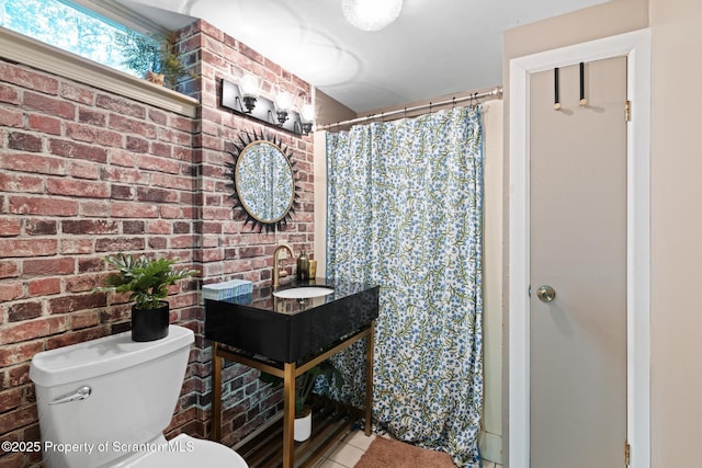 805 E Mountain Rd, Scranton, PA 18505 - full bathroom featuring tile patterned floors, brick wall, vanity, and a shower with shower curtain