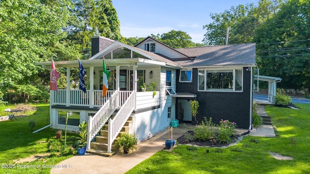 805 E Mountain Rd, Scranton, PA 18505 - view of front of home with covered porch, stairs, a front lawn, and a chimney