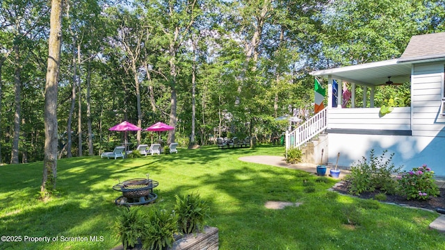 805 E Mountain Rd, Scranton, PA 18505 - view of grassy yard featuring ceiling fan, an outdoor fire pit, and stairs