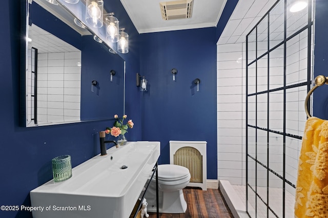 805 E Mountain Rd, Scranton, PA 18505 - bathroom featuring wood finished floors, ornamental molding, tiled shower, and vanity