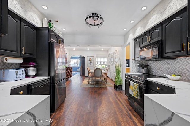 805 E Mountain Rd, Scranton, PA 18505 - kitchen with black appliances, arched walkways, dark cabinetry, decorative backsplash, and recessed lighting