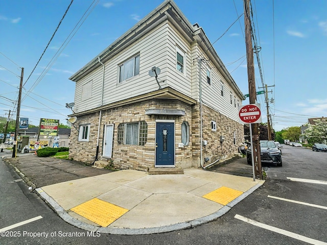 view of front of house featuring stone siding