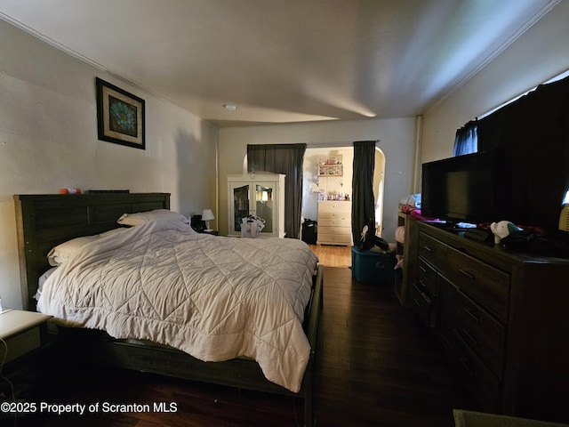 bedroom with wood finished floors
