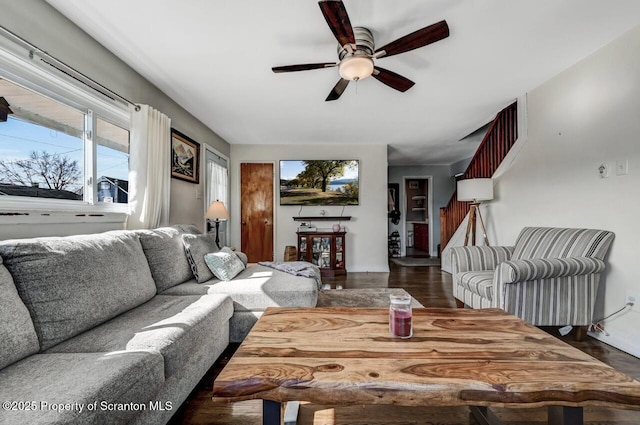 living room featuring wood finished floors and ceiling fan