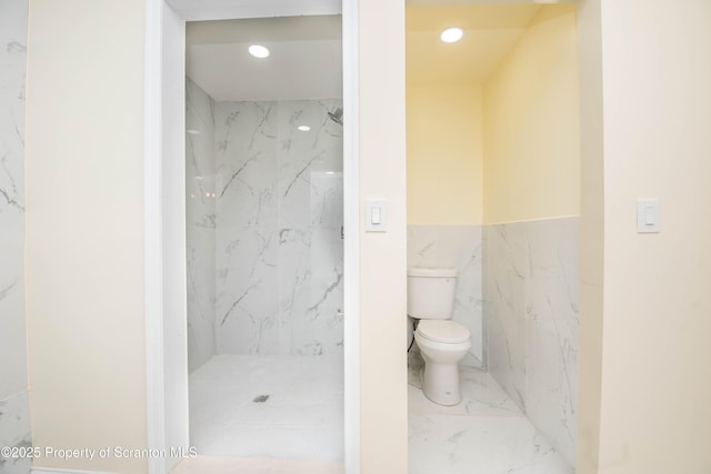 full bath featuring marble finish floor, toilet, a marble finish shower, and recessed lighting