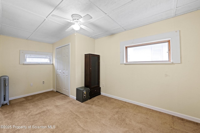 2211 Myrtle St, Scranton, PA 18510 - unfurnished bedroom featuring carpet flooring, a closet, ceiling fan, and radiator heating unit