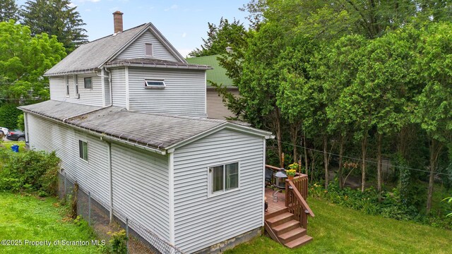 2211 Myrtle St, Scranton, PA 18510 - rear view of house with a deck, a lawn, roof with shingles, and a chimney