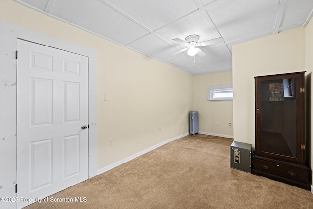 2211 Myrtle St, Scranton, PA 18510 - unfurnished living room with carpet, ceiling fan, radiator, and a drop ceiling