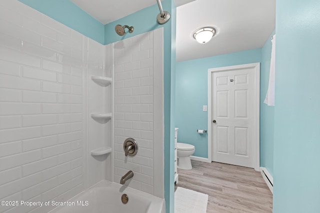 2211 Myrtle St, Scranton, PA 18510 - bathroom with shower / washtub combination, wood finished floors, and a baseboard heating unit