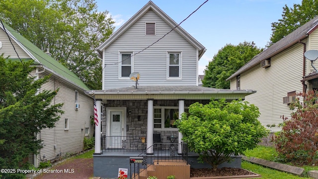 2211 Myrtle St, Scranton, PA 18510 - view of front facade with covered porch, a wall mounted AC, and stone siding