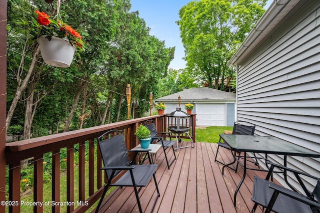 2211 Myrtle St, Scranton, PA 18510 - wooden terrace featuring an outbuilding, a garage, and outdoor dining space